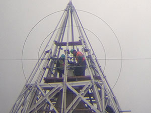 The view of the top of the Monument as viewed through the Total Station surveying tool, captured by placing a smartphone camera up to the eyepiece.