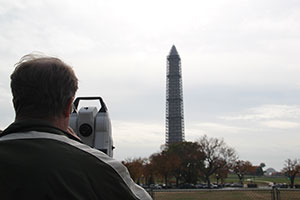 Steve Breidenbach measures the vertical angle and distance to the peak of the Washington Monument.