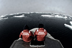 NOAA officers aboard one of the smaller survey vessels contemplate the vastness of the Chukchi Sea during the NOAA Ship Fairweather's reconnaissance survey in 2013