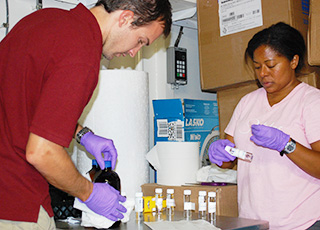 Two scientists testing water samples