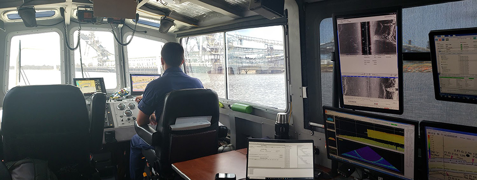 Officer operating a vessel.