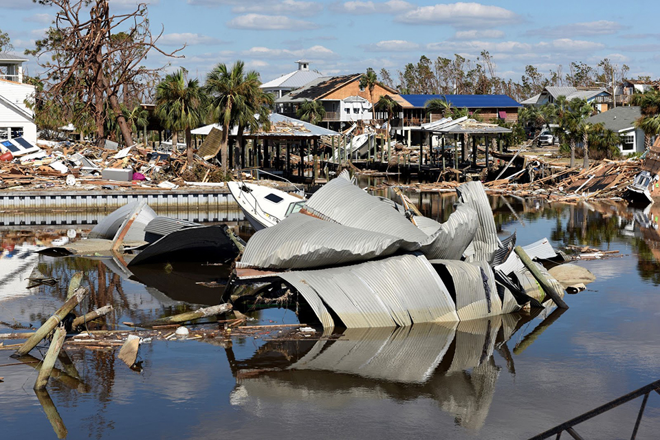 Image of wrecked boats and buildings on and near the water following Hurricane Michael in Mexico Beach, Florida.