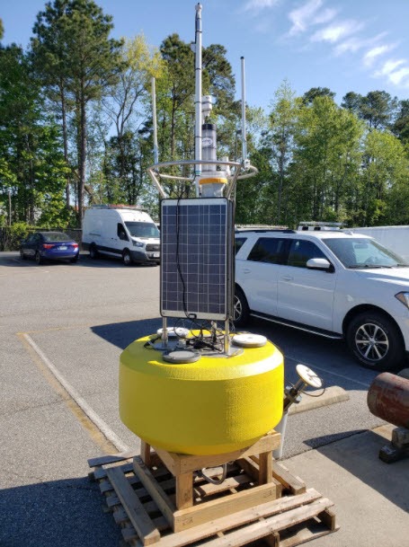 Yellow CURBY system in a parking lot.