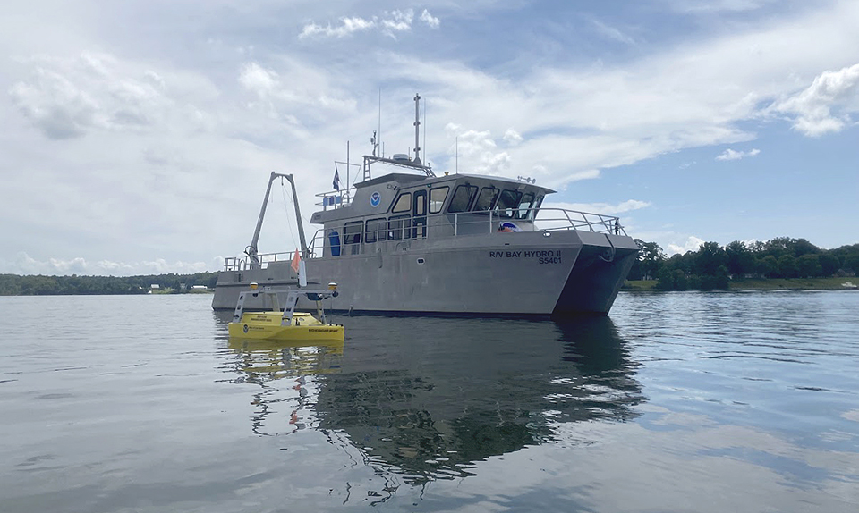 NOAA's Bay Hydro II on the water with the Echoboat 240, an uncrewed surface vehicle, in the foreground.