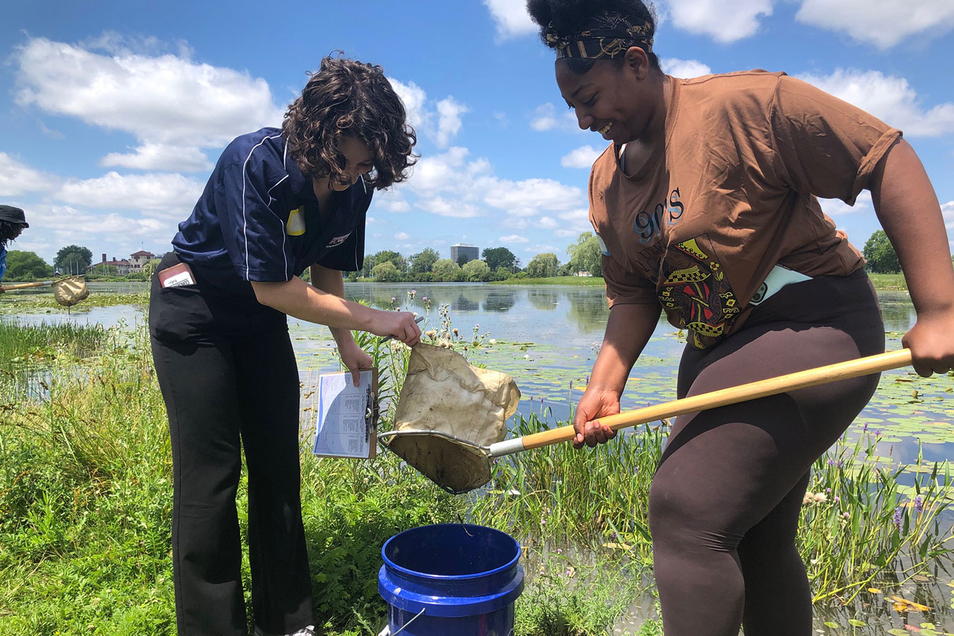Teachers sample a local pond to determine the health of the water during the July 2023 NOAA Planet Stewards summer workshop on Climate Justice: Exploring the Science of Climate Change in Your Classroom. Credit: NOAA