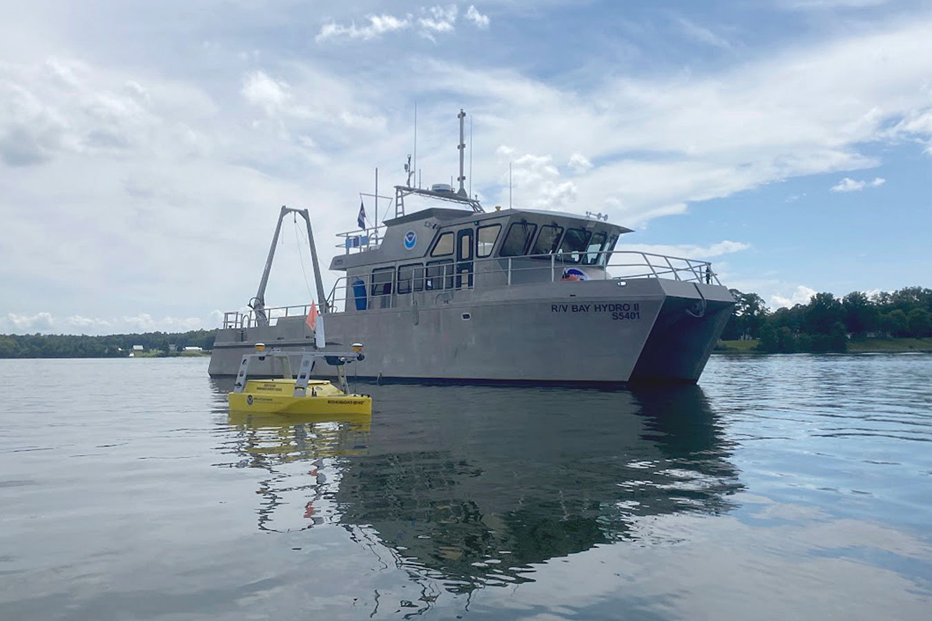 NOAA's Bay Hydro II on the water with the Echoboat 240, an uncrewed surface vehicle, in the foreground. Credit: NOAA