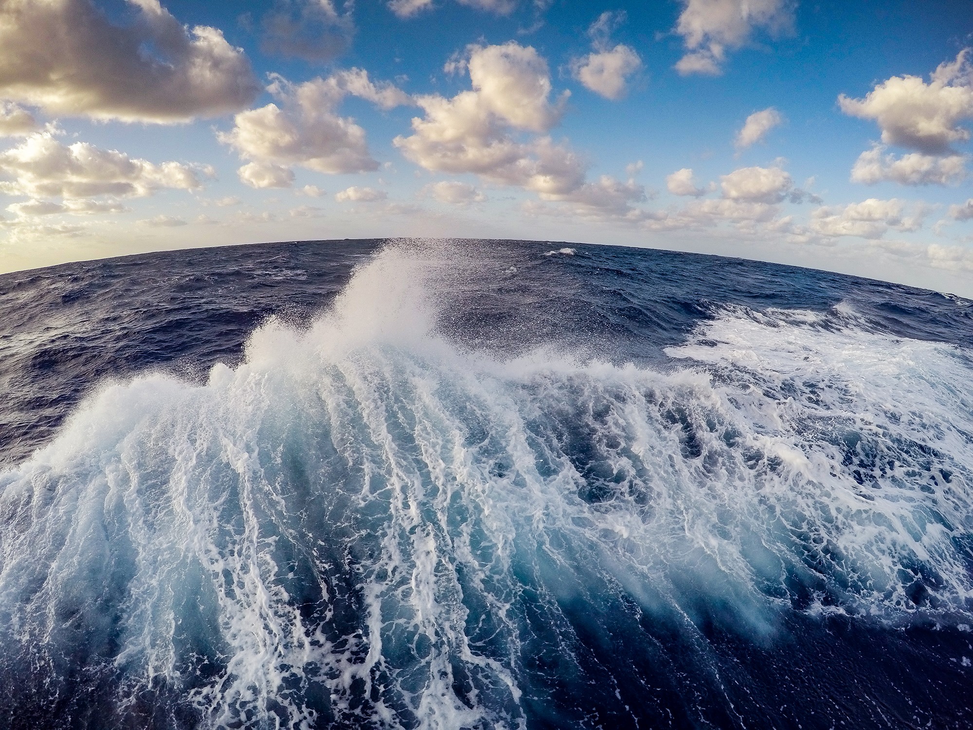 Fish-eye view of wake at sea. (Credit: NOAA/Office of Ocean Exploration)