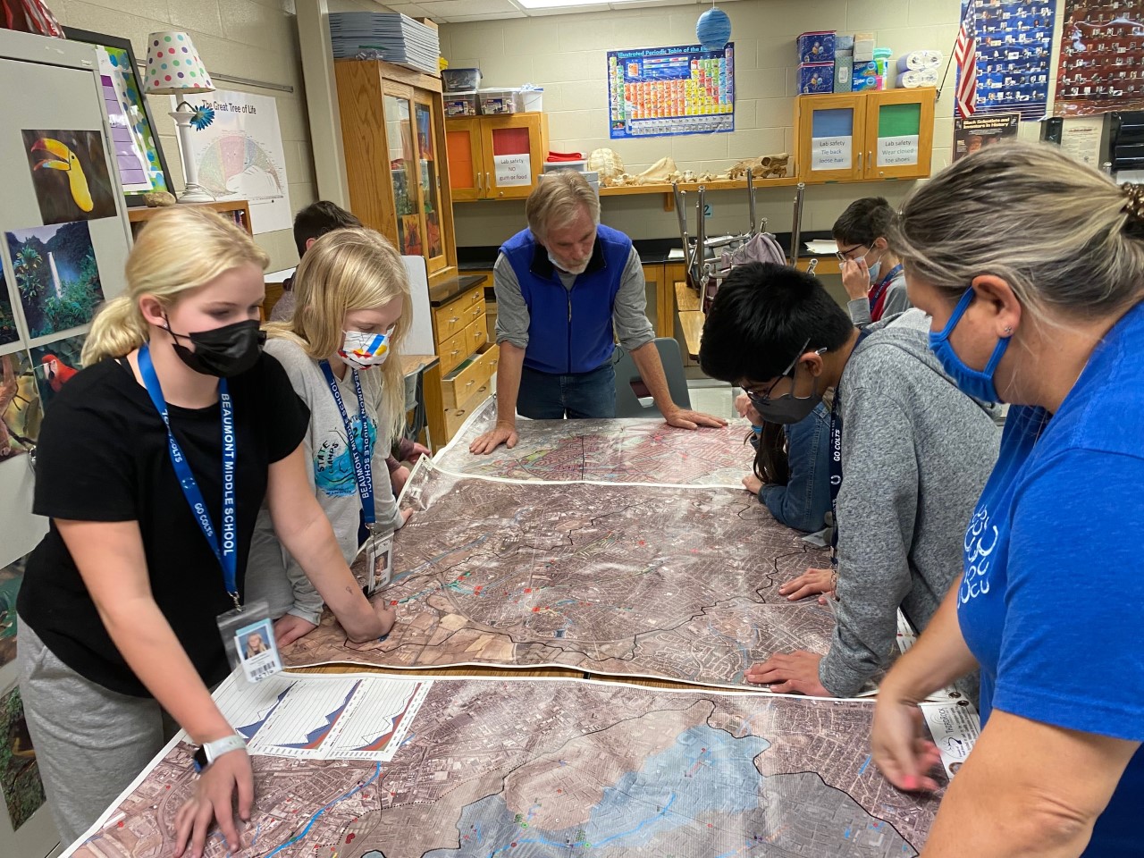 Students studying the geography and topography of their local watershed to better understand the impact of their project.