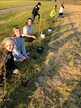 Students planting plants.