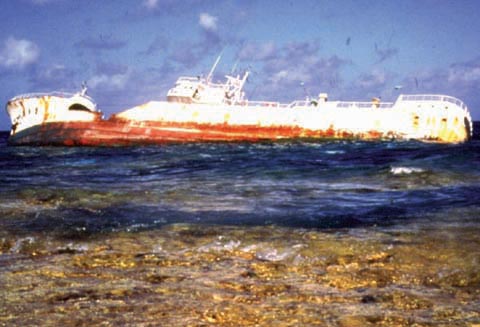 grounded ship on coral reef