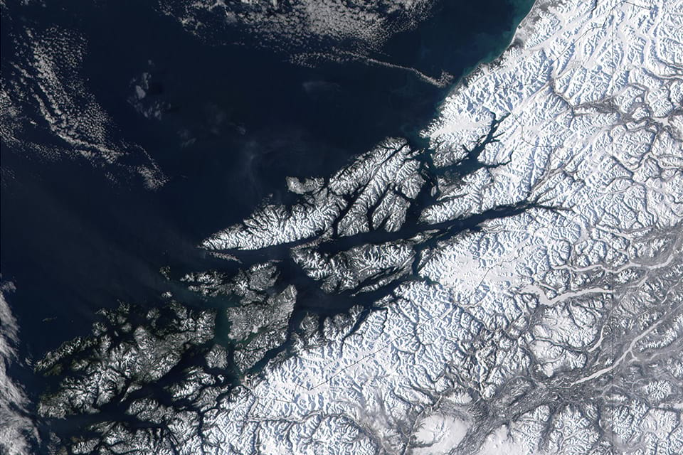 West of British Columbia, Canada, and south of the Yukon Territory, the southeastern coastline of Alaska trails off into the islands of the Alexander Archipelago. Photo Credit: NASA