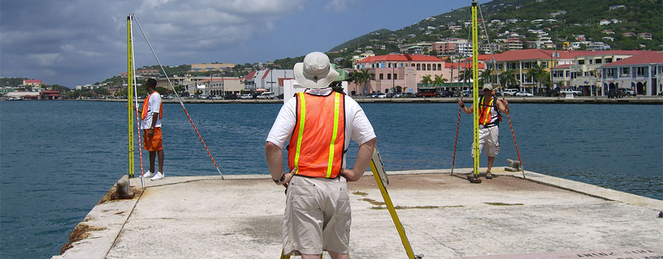 NOAA surveyers level to a pier on St. Thomas Island.