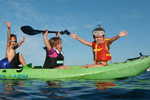 kids in a kayak