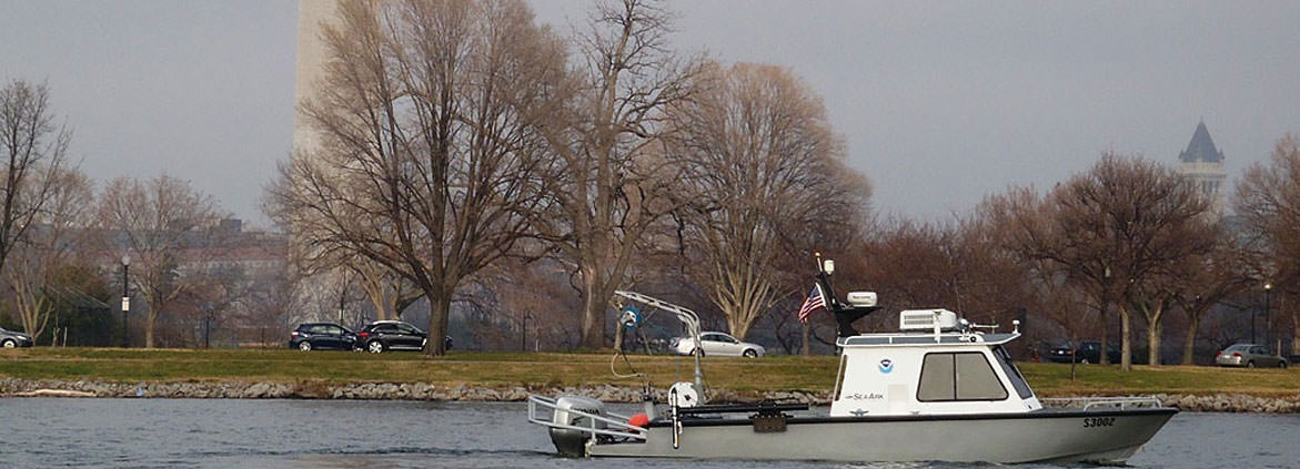 a NRT vessel surveys the Potomac River Tidal Basin near the Washington Monument