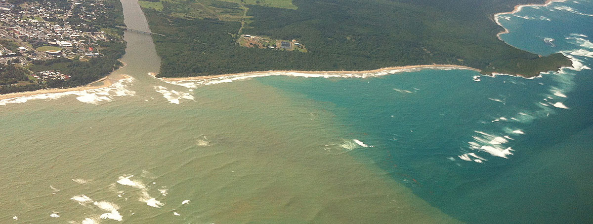 aerial photo of a sediment plume stretching for miles off the northeast coast of Puerto Rico