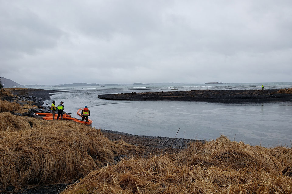 Boom deployment and oil sheen at the mouth of the Buskin River, Kodiak, Alaska