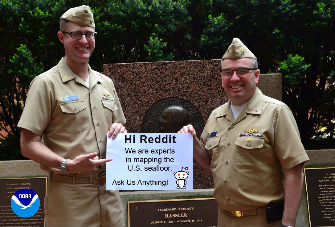 Rear Admiral Shepard Smith and Lt. Cdr. Sam Greenaway holding Reddit sign