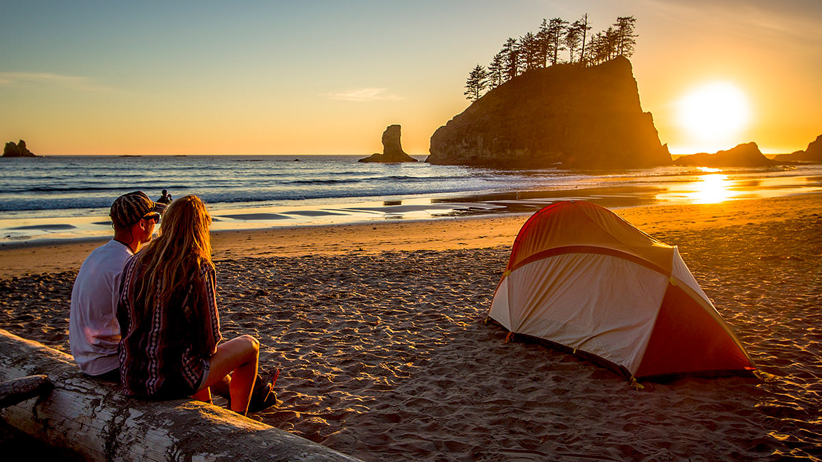 Campers on the beach view the sea stacks at Olympic Coast National Marine Sanctuary