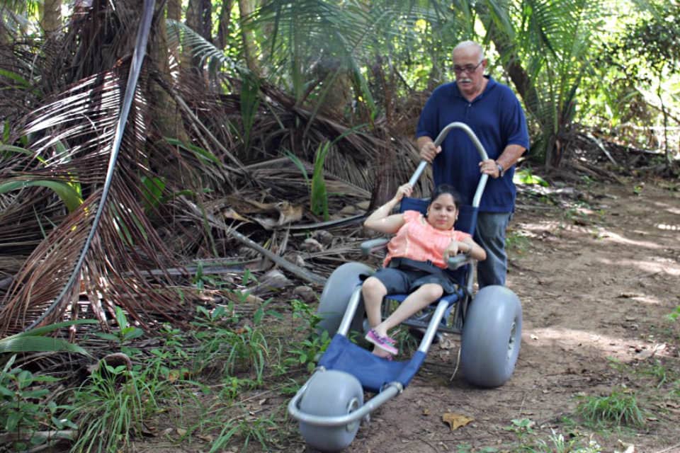 a disabled person enjoying a trail within the Punta Tuna Wetland Natural Reserve in Puerto Rico.