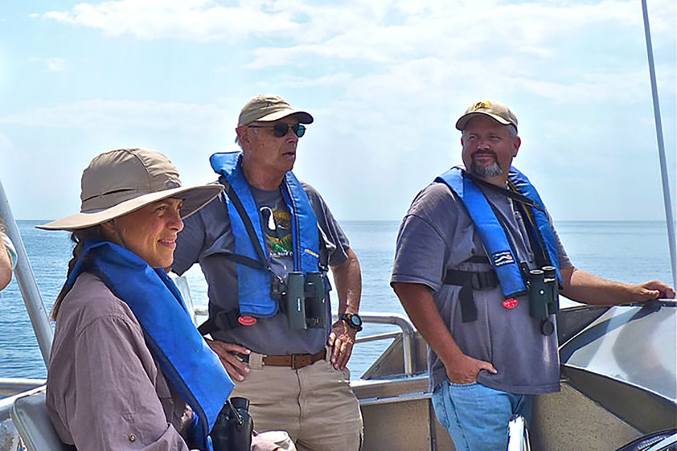 photo of volunteers with binoculars