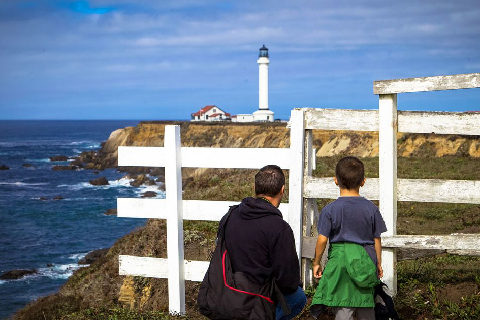 visitors looking out at California's historic Point Arena Lighthouse