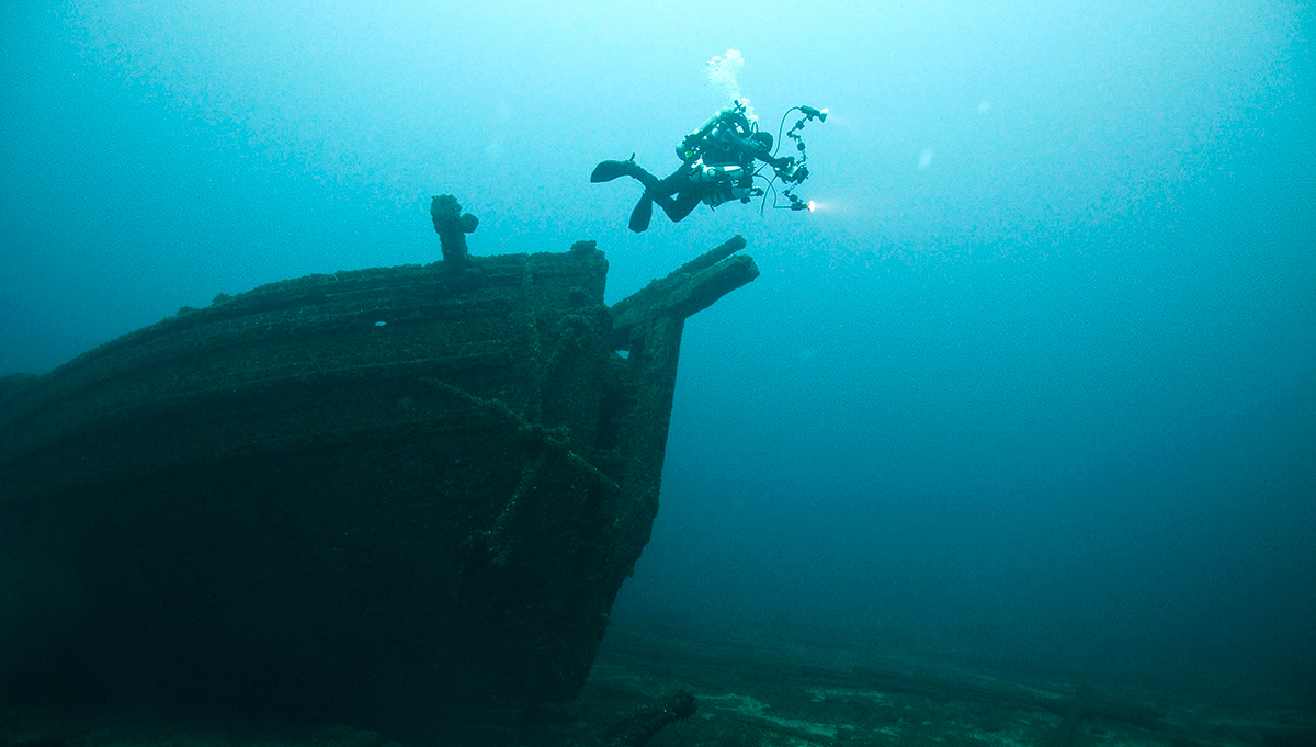 a diver exploring a shipwreck in Thunder Bay