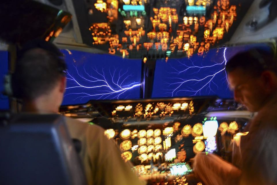 U.S. Air Force KC-10 pilots experience a weather phenomenon called St. Elmo Fire while flying through a thundercloud in an undisclosed location, March 22, 2017. The phenomenon occurs when the electric field around the aircraft causes ionization of the air molecules, producing a glow and sparks easily visible in low-light conditions. U.S. Air Force photo by Senior Airman Brian Kelly.